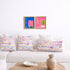 Multicolor abstract wall art print artwork and decorative throw pillows on couch by Kerri Rosenthal