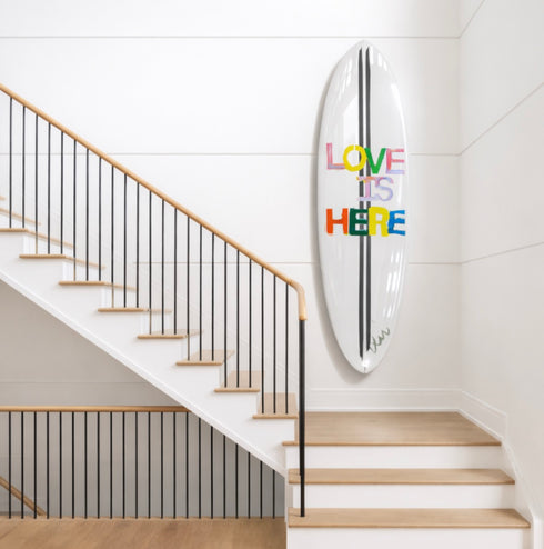 A multicolor surfboard craft that makes a bold, loving statement, whether it's hung on the wall or catching waves.
