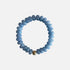 Seally Mimi blue jean monochrome bracelet is made from smooth semi-precious quartz - An 18K gold-plated bead is handmade in Switzerland