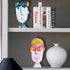 vibrant colorful face Chic In Capri Rock of Love acrylic sculpture home decor styled in bookcase