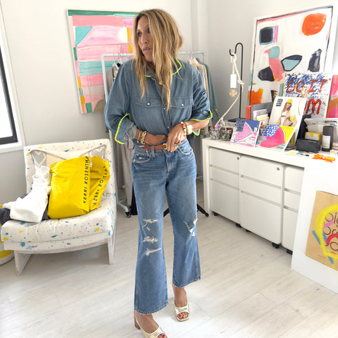 Western-style denim shirt with neon green stitching, chest pockets and a relaxed fit. made from 100% cotton with a button front.