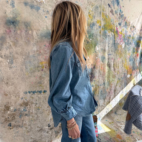 Puff-sleeve button-front blue denim shirt made from 100% cotton with double pockets and a ruffled neckline - Shop cute women’s button shirts by Kerri Rosenthal