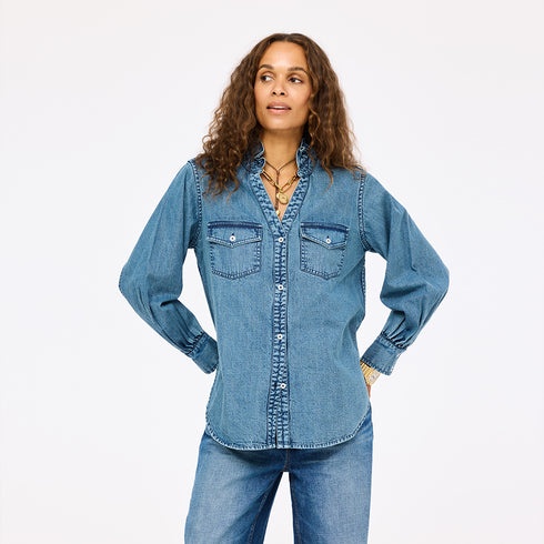 Puff-sleeve button-front blue denim shirt made from 100% cotton with double pockets and a ruffled neckline - Shop cute women’s button shirts by Kerri Rosenthal