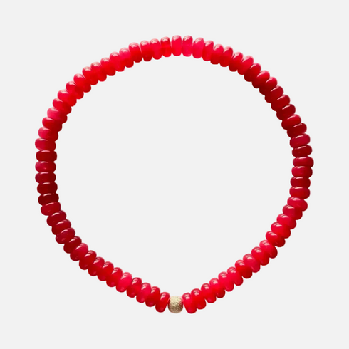 Red monochrome stone semi-precious bead necklace is made from tinted quartz & an 18K gold-plated bead. Handmade in Switzerland.