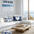 Reversed white heart on navy blue throw pillows on couch - Shop designer decorative pillows by Kerri Rosenthal