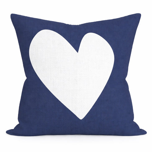 Reversed white heart on navy blue throw pillow from the Kerri Rosenthal. In the finest linen with down and poly in square and rectangular lumbar