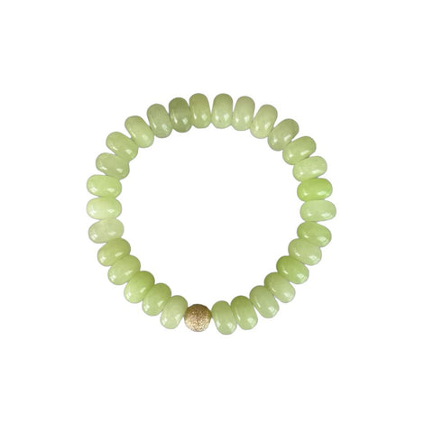 Almond green stone bead bracelet is made from smooth semi-precious stones. Aventurine beads with an 18K gold bead is handmade in Switzerland.