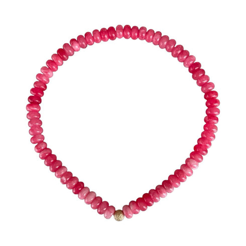 Seally Mimi fuchsia stone bead bracelet is made from smooth semi-precious stones. Tinted agate beads with an 18K gold bead is handmade in Switzerland.