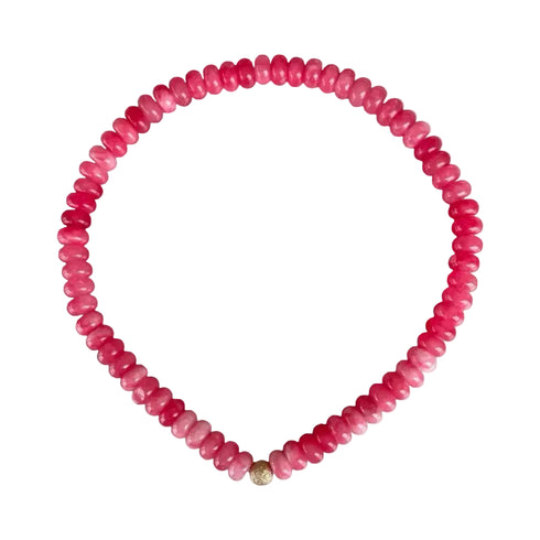 Seally Mimi fuchsia stone bead bracelet is made from smooth semi-precious stones. Tinted agate beads with an 18K gold bead is handmade in Switzerland.