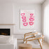 Modern living room with a fireplace, white sofa, wooden armchair, and pink abstract art on the wall.