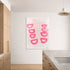 Modern kitchen with a white wall featuring a pink abstract art print. Original painting by Kerri Rosenthal.
