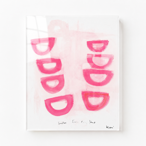 Art print with pink half-moon shapes on a white background. Framed in plexi glass. Original painting by Kerri Rosenthal.