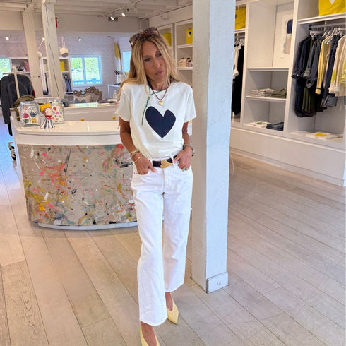 Suke off white vanilla tee navy blue heart on front with white billie alabaster mid rise straight leg jean - Cute women's tees and jeans by Kerri Rosenthal