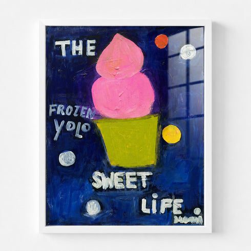 Pink frozen yogurt cone painting in white wood frame, playful navy blue background with polka dots and "Frozen Yolo Sweet Life" text