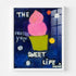 Pink frozen yogurt cone painting in white wood frame, playful navy blue background with polka dots and "Frozen Yolo Sweet Life" text
