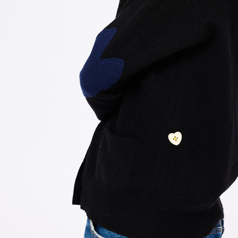 The Jackie button-front black cardigan is made from 100% cashmere with a V-neck and double pockets - Shop cute women’s cardigans by Kerri Rosenthal