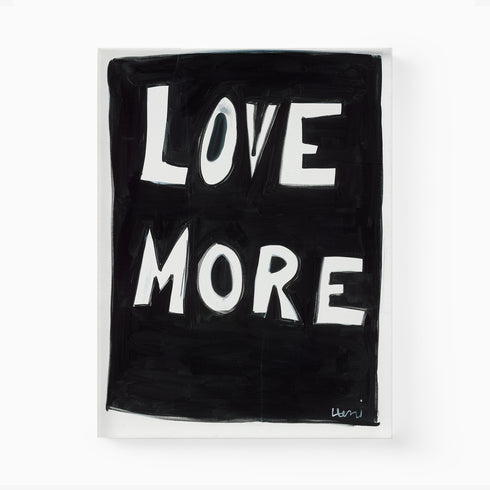 A playful way to share the positive love message "Love More" A black and white original word wall art painted by Kerri Rosenthal
