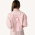 Back view of a pink striped shirt with 'LOVE' lettering and heart elbow patches.