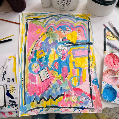 Colorful abstract drawing on paper with art supplies around