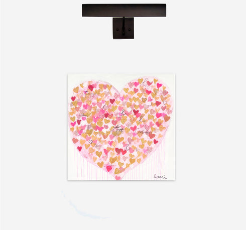 Heart-shaped design with pink and gold hearts on a white background, mounted on a black frame.
