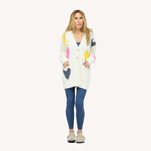 SoulCycle x KR Poppy Soul Brigade off white long cardigan in 100% cotton with colorful heart patches by Kerri Rosenthal