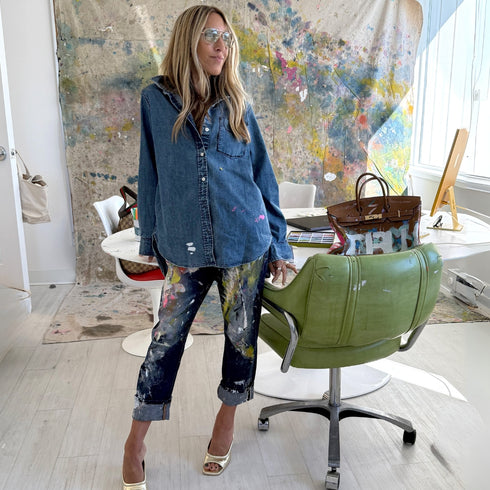 Women's denim button-down blue shirt made from 100% cotton featuring hand-painted work of heart artwork with drip designs created in Kerri's studio