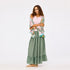 Kerri Rosenthal Dream Maxi Skirt in Amalfi green silk, tiered with a flowing hem.