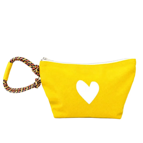 A bright yellow fabric pouch with a white heart cutout on the front and a braided multicolor wrist strap, shown on a plain white background.