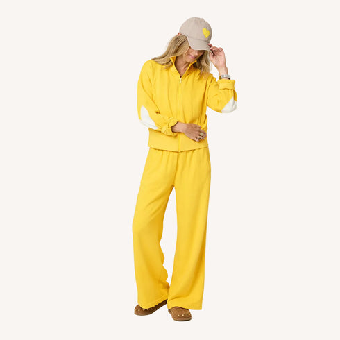 Zip-up mock neck yellow sweatshirt in cotton loop terry with heart-tonal elbows and baseball cat hat by Kerri Rosenthal
