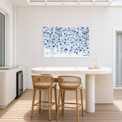 Starry Starry Love by Kerri Rosenthal — hand-painted hearts and stars in blue, navy, and grey on aluminum. Outdoor art. On outdoor patio with outdoor bar.