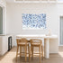 Starry Starry Love by Kerri Rosenthal — hand-painted hearts and stars in blue, navy, and grey on aluminum. Outdoor art. On outdoor patio with outdoor bar.