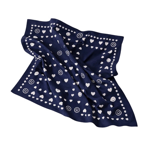 Blue bandana scarf with white heart and dot print.