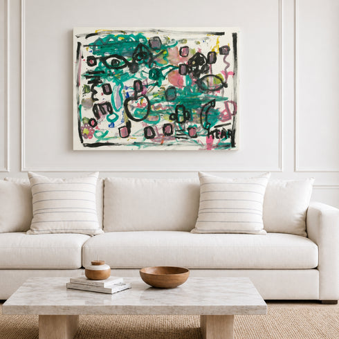 Canvas abstract canvas painting by Kerri Rosenthal with teal, black and pink heart motifs above white sofa in light, paneled living room
