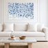 Starry Starry Love by Kerri Rosenthal — hand-painted hearts and stars in blue, navy, and grey on canvas in white living room with white and grey stripe pillows.