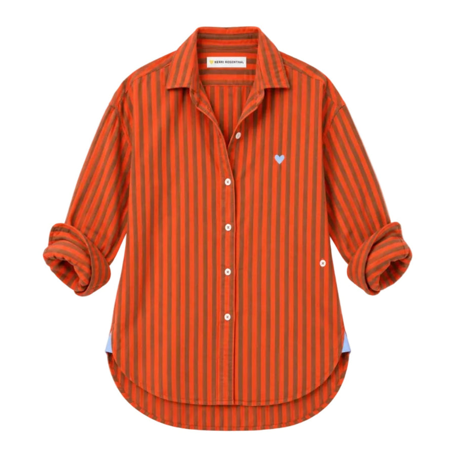 Flat lay of orange and brown striped button-down shirt with a small blue heart embroidery