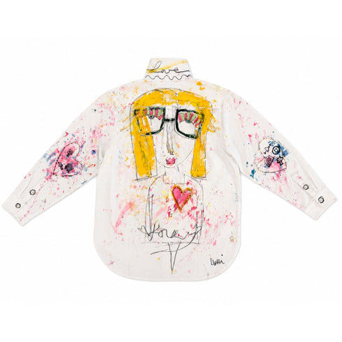 White button-down shirt hand-painted on the back with a whimsical face featuring yellow hair, striped glasses, and a pink heart on the chest, 'Love' script on the collar, heart and doodle patches on both sleeves, and colorful paint splatters throughout — Kerri Rosenthal wearable art