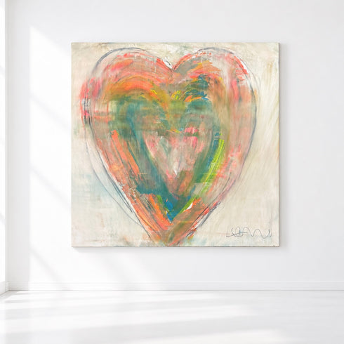 Love in Soft Focus, an original heart painting in coral, orange, and teal on a cream canvas, on a white wall.