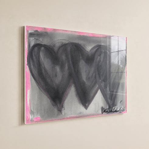 Close-up of hand-painted 3 black connecting hearts and gray and pink background texture and brushstrokes on Holding Hearts art print in plexi frame by Artist Kerri Rosenthal.