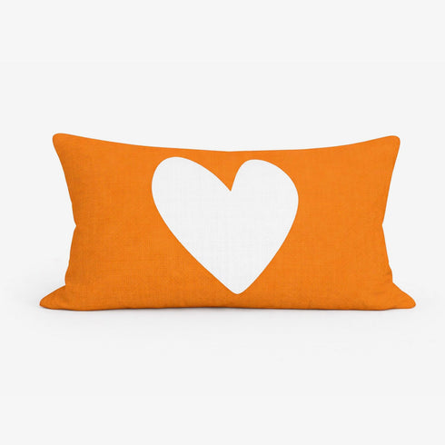 Reverse White Heart Throw Pillow with bright orange background in rectangular lumbar by Kerri Rosenthal. Cute colorful throw pillows for modern home decor.