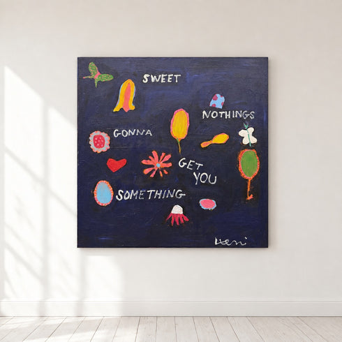 Large midnight blue Sweet Nothings painting hung on a white wall above pale wood floors, sunlight falling across the canvas