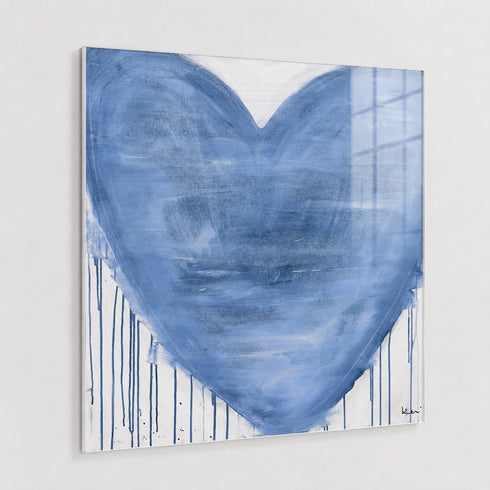 A square canvas wall art print featuring a large textured blue heart with vertical paint drips on a white background, hanging on a light gray wall.