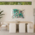 Framed abstract painting by Kerri Rosenthal with teal, black and pink heart and eye motifs displayed above dining table in modern neutral dining room