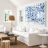 Starry Starry Love by Kerri Rosenthal — hand-painted hearts and stars in blue, navy, and grey in white frame in white living room.
