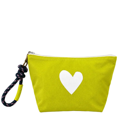 A bright lime green canvas zippered pouch with a white heart printed on the front, featuring a black and pink patterned wrist strap with a yellow accent.