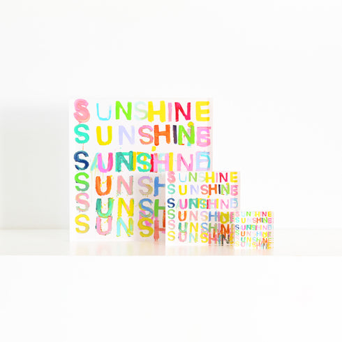 Here Comes The Sun Block of Love by Kerri Rosenthal. Blocks of Love are signed, mini editions of Kerri Rosenthal's word artwork mounted on 3/4" plexiglass acrylic block.