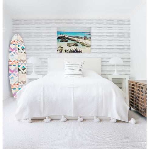 Designed to look like a patchwork quilt, this board is handcrafted and signed, making it perfect for both surf and style lovers.