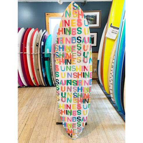 A bright, sun-themed design makes this board the perfect addition to a modern coastal interior.