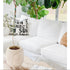 White ground with black carbon Sunshine cute square decorative throw pillows on couch by Kerri Rosenthal