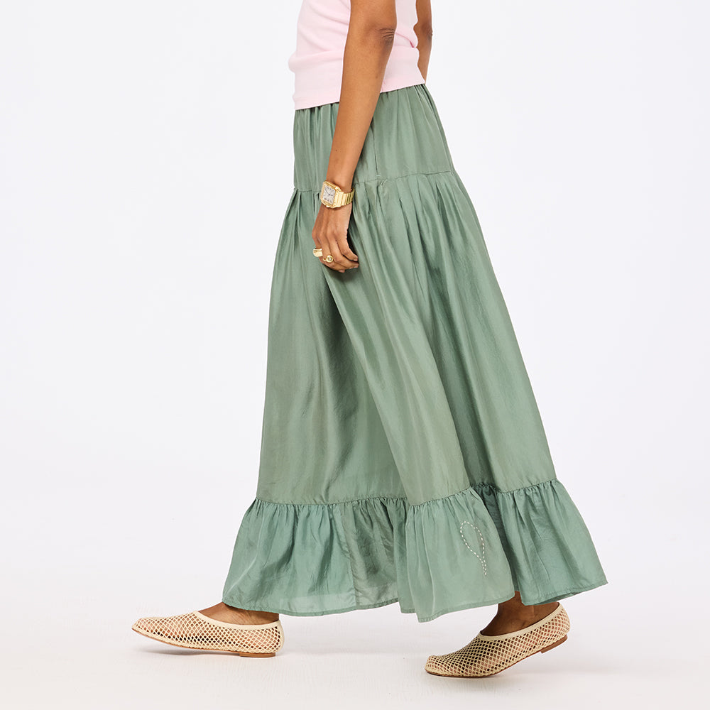 Women's amalfi green tiered maxi skirt side view. Shop Kerri Rosenthal skirts
