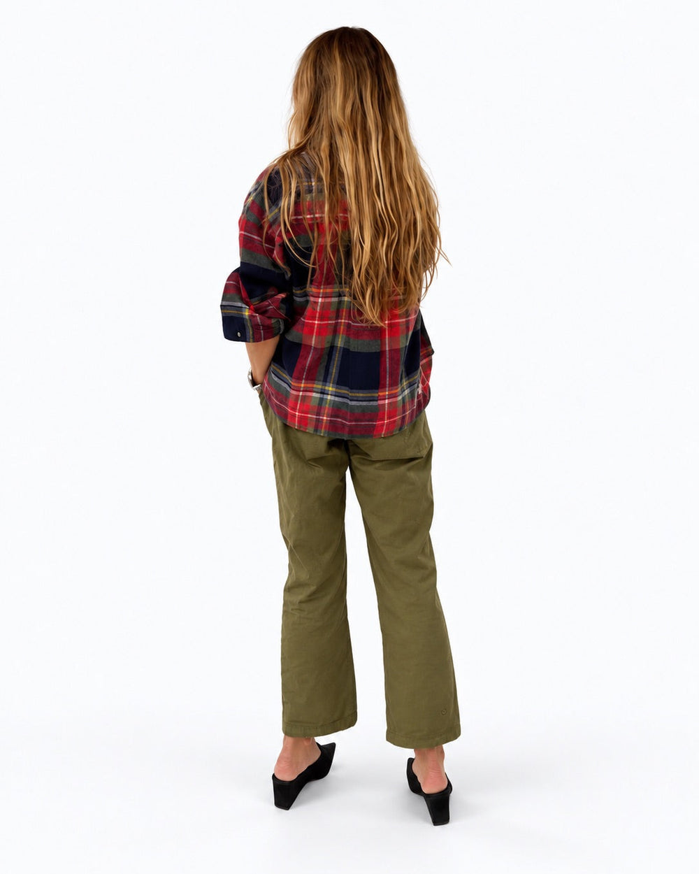 Kerri wearing the Tia Flannel Shirt in plaid with olive pants, back view